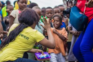 volunteer greeting african kids